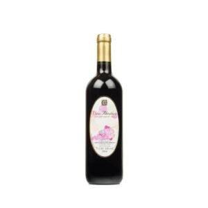 Bottle of red wine with a gold foil top and a pink-flowered label against a white background