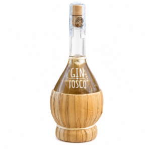 Gin bottle with a tall neck, cork stopper, and a straw-wrapped base; label reads 'GIN TOSCO'.